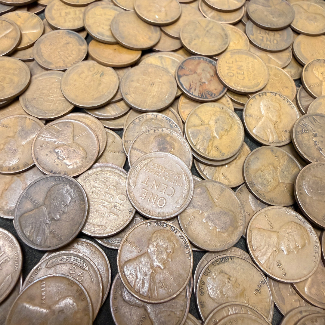 Collection of silver coins with various designs and inscriptions.