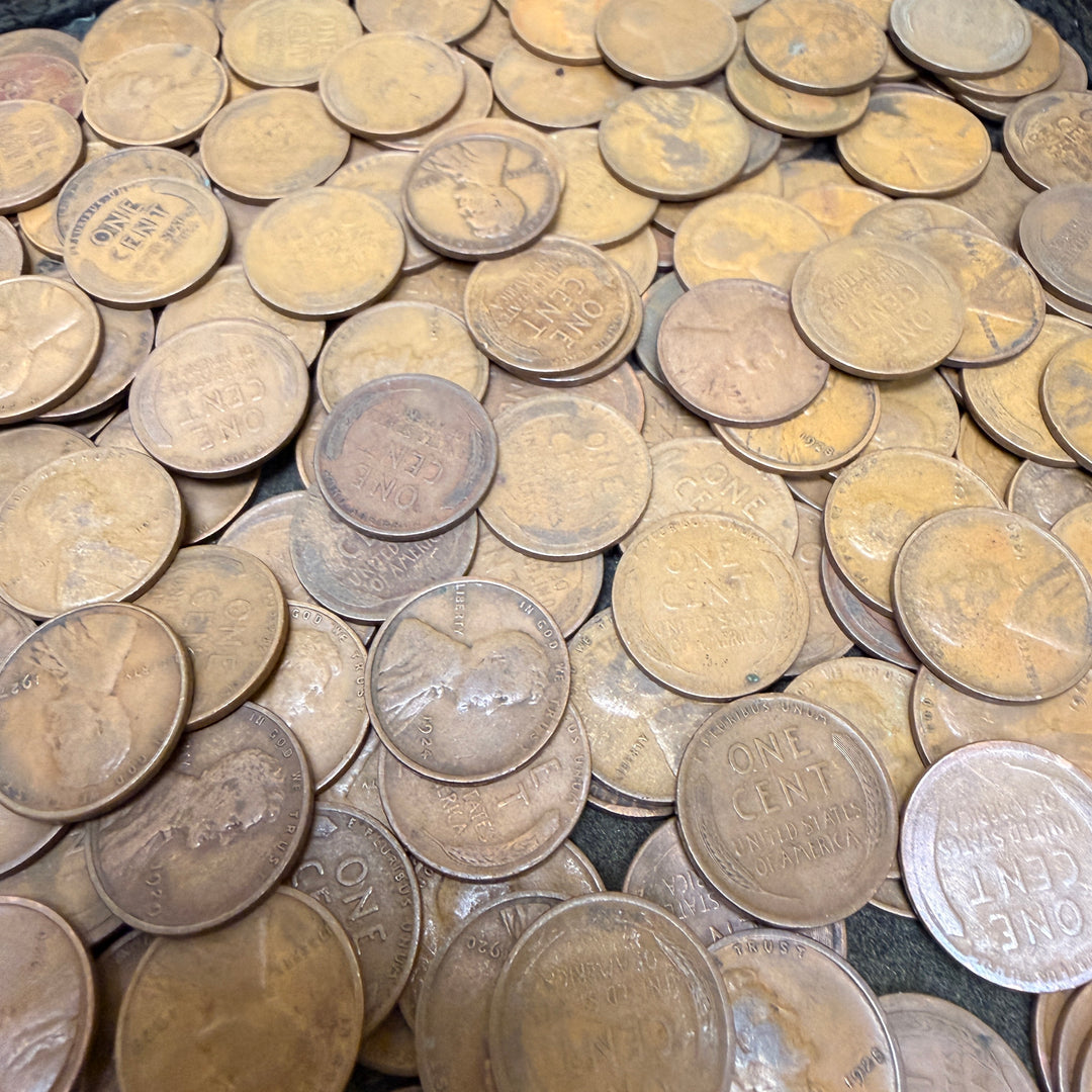 Collection of old coins with various designs and text.