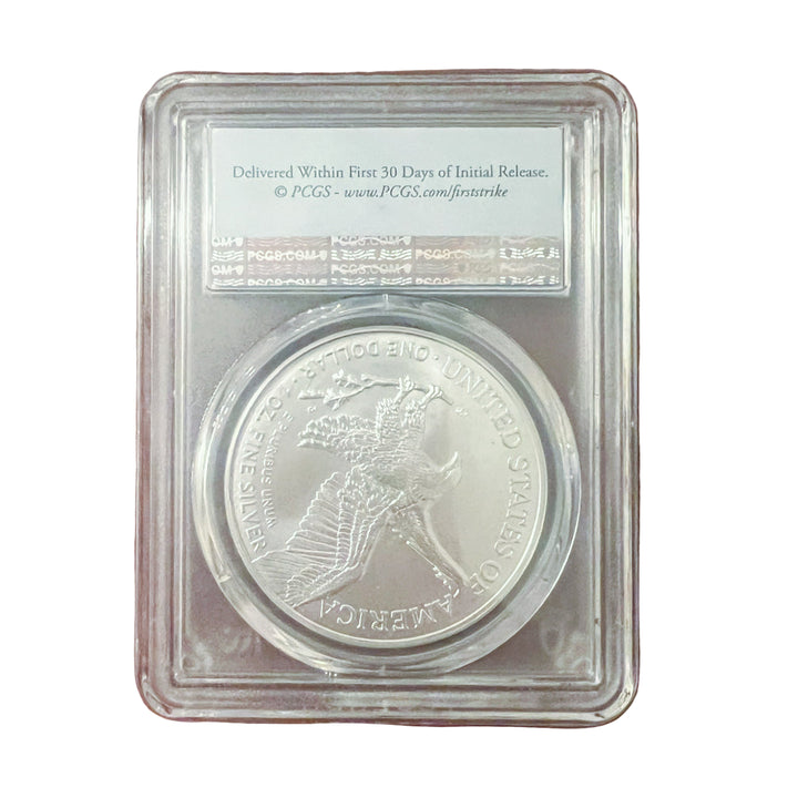 Silver coin in a protective case on a wooden surface